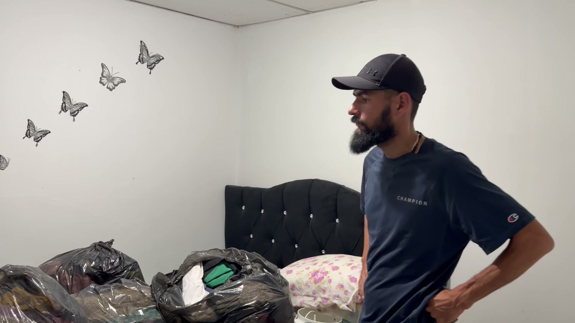 Edwin inside the damaged home